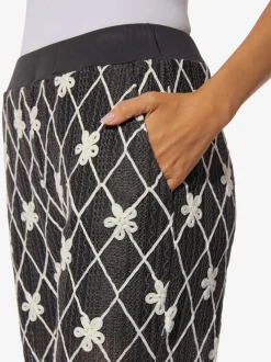 Pantalon avec motifs losanges et fleurs à ceinture élastique