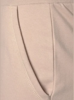 Pantalon confortable avec poches fendues et ourlet à revers