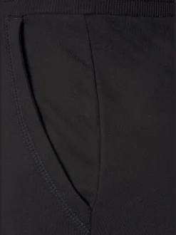 Pantalon confortable avec poches fendues et ourlet à revers