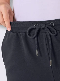 Pantalon court en matière sweat avec passepoil double sportif et ceinture élastique