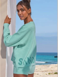 Pantalon court en tricot doux avec logo brodé et finition agréable