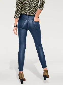 Pantalon effet ventre plat avec coupe skinny et brillance raffinée