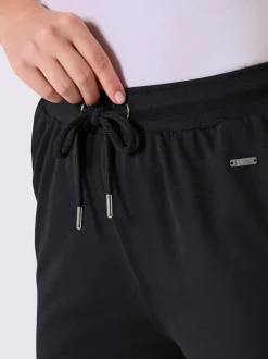 Pantalon en matière sweat avec ceinture élastique et passepoil sportif