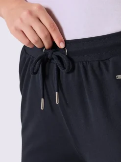 Pantalon en matière sweat avec ceinture élastique et passepoil sportif