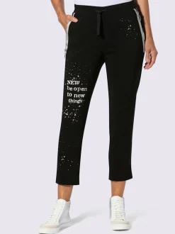 Pantalon extensible avec inscription décorative et poches zippées