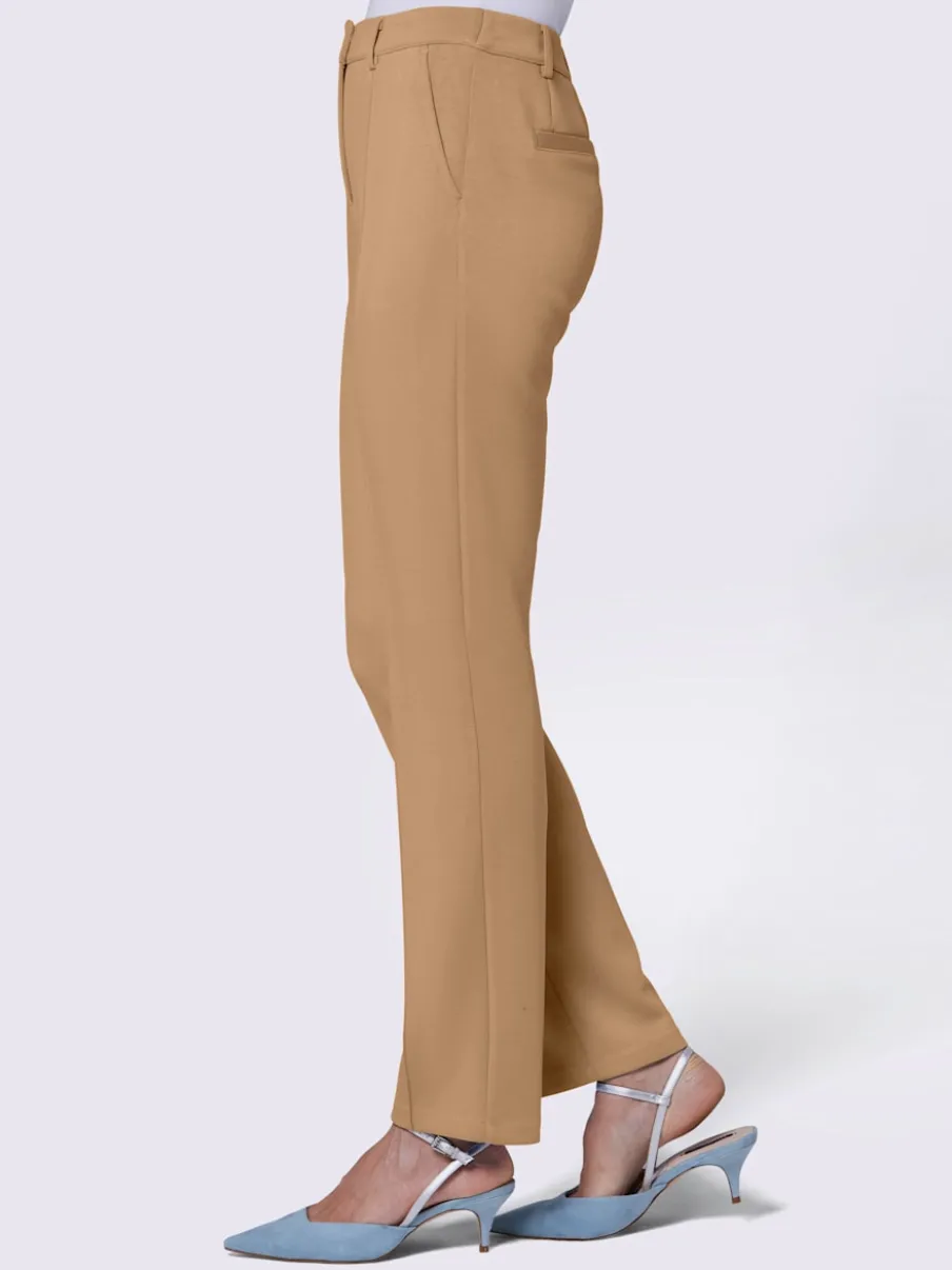 Pantalon extensible à poches et nervures pour un effet affinant