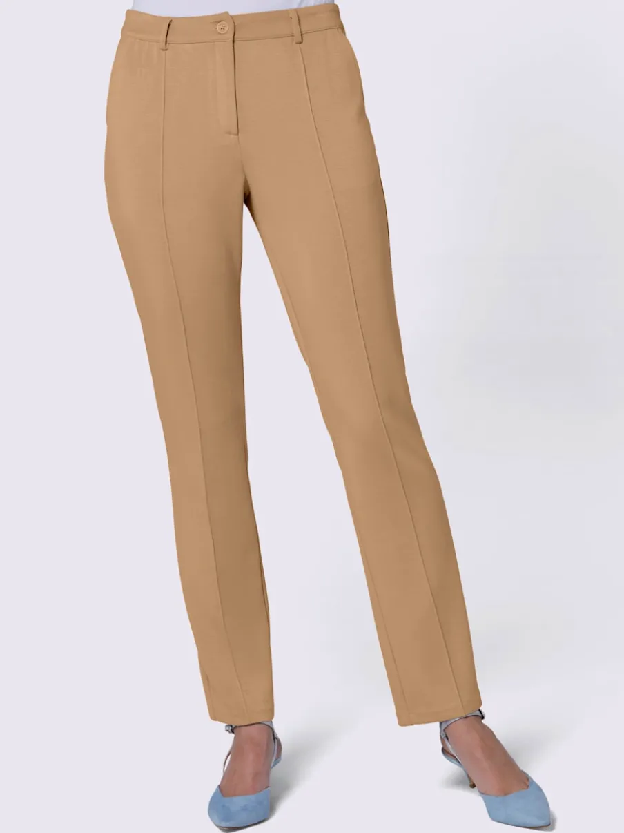 Pantalon extensible à poches et nervures pour un effet affinant