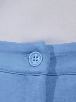 Pantalon extensible à poches et nervures pour un effet affinant