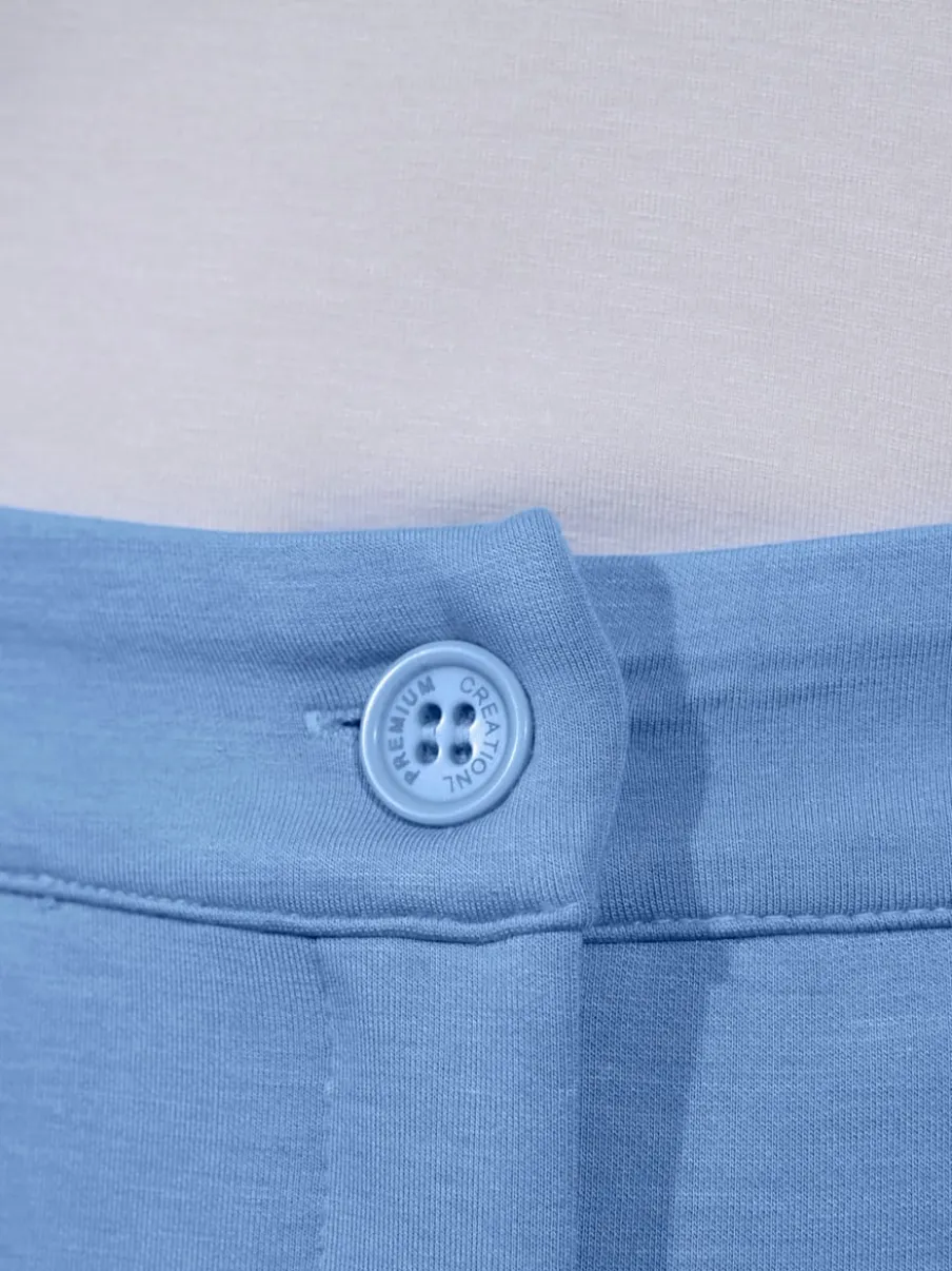 Pantalon extensible à poches et nervures pour un effet affinant