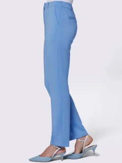 Pantalon extensible à poches et nervures pour un effet affinant