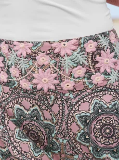 Pantalon à fleurs avec large jambes et poches cousues