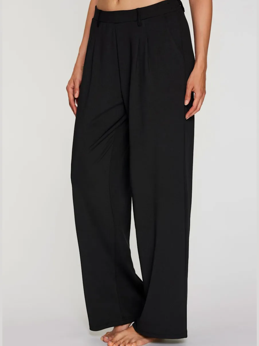 Pantalon fluide à taille haute avec poches latérales et jambes larges