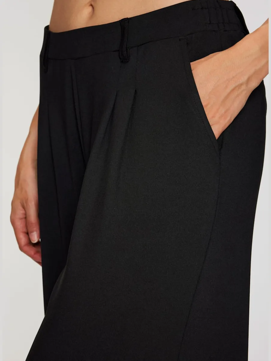 Pantalon fluide à taille haute avec poches latérales et jambes larges