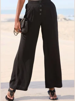 Pantalon à jambes extra-amples avec poches latérales smockées