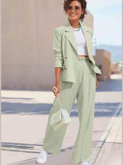 Pantalon large avec pinces à poches fendues et décoratives