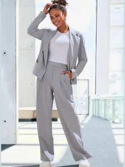 Pantalon large avec pinces à poches fendues et décoratives