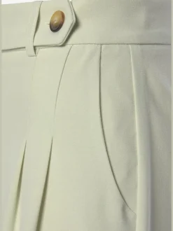 Pantalon large avec pinces à poches fendues et décoratives