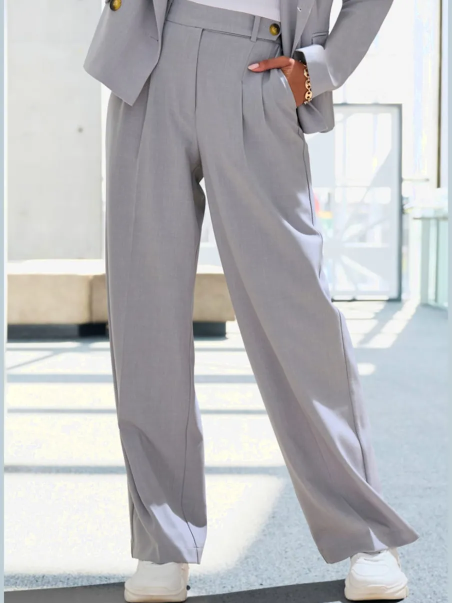Pantalon large avec pinces à poches fendues et décoratives