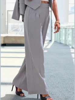 Pantalon large avec pinces à poches fendues et décoratives
