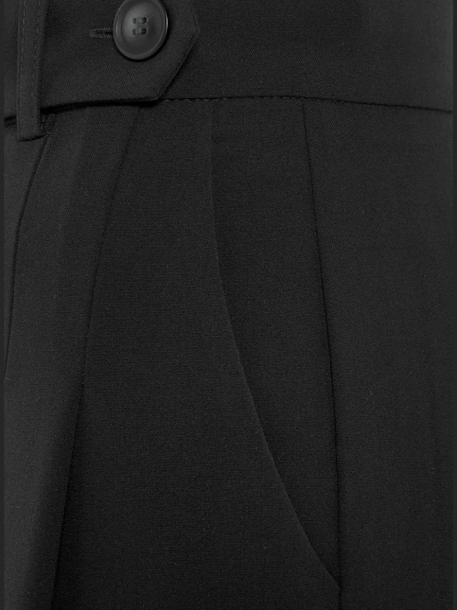 Pantalon large avec pinces à poches fendues et décoratives