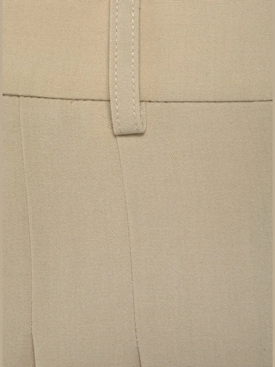 Pantalon large avec pinces à poches fendues et décoratives