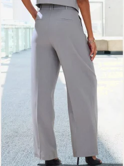 Pantalon large avec pinces à poches fendues et décoratives