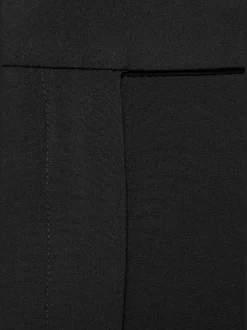 Pantalon large avec pinces à poches fendues et décoratives