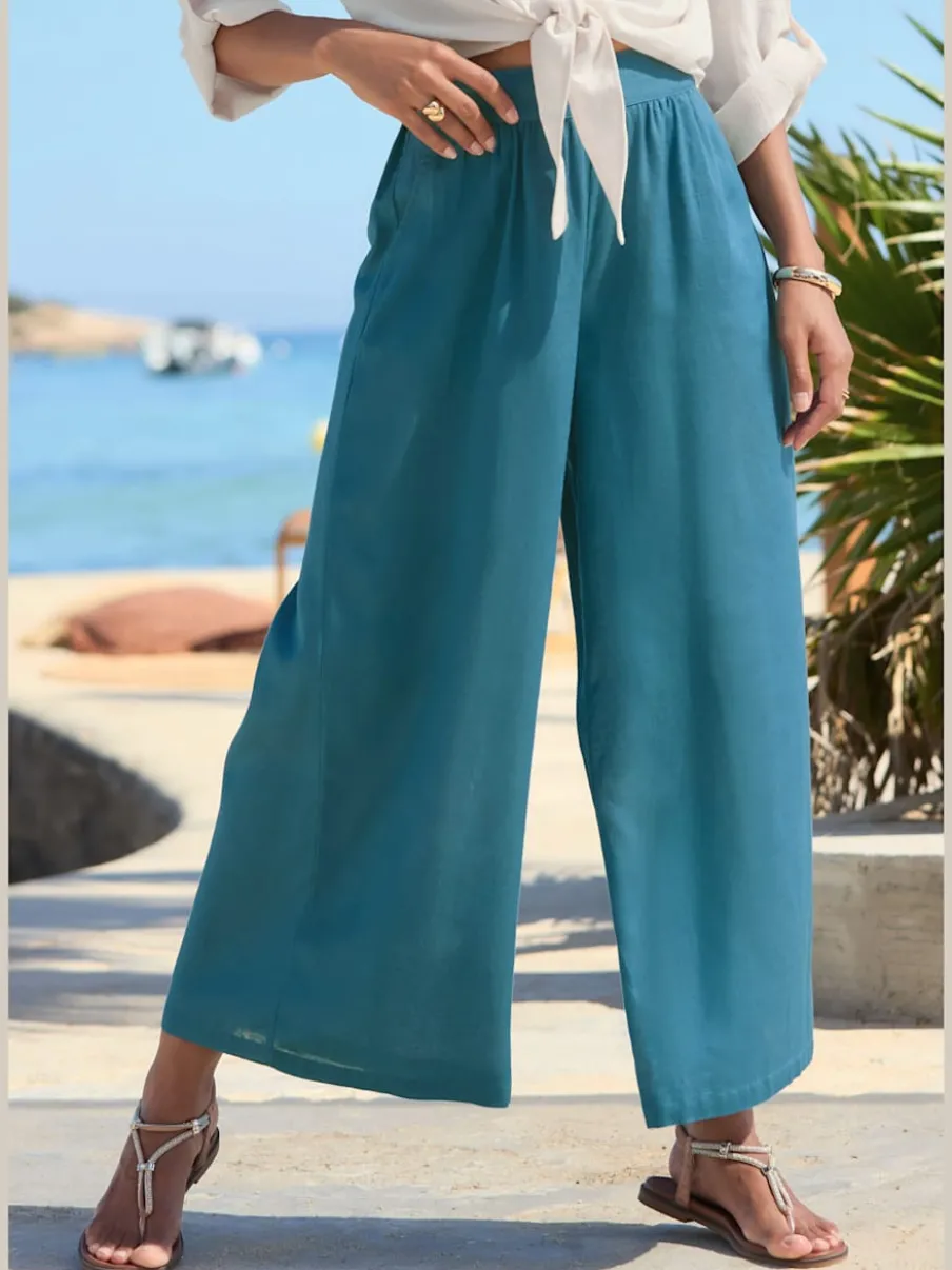 Pantalon large à ceinture plate et élastique au dos