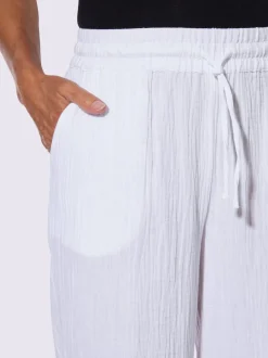 Pantalon large en mousseline avec taille haute et poches