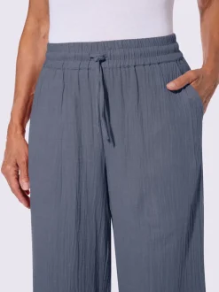 Pantalon large en mousseline avec taille haute et poches