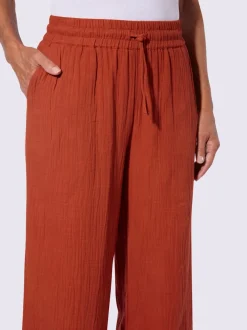 Pantalon large en mousseline avec taille haute et poches