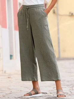 Pantalon large en mousseline avec taille haute et poches
