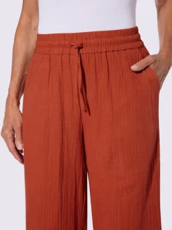 Pantalon large en mousseline avec taille haute et poches