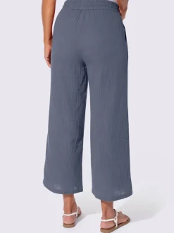Pantalon large en mousseline avec taille haute et poches
