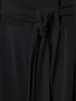 Pantalon large jupe-culotte rayé avec ceinture à nouer