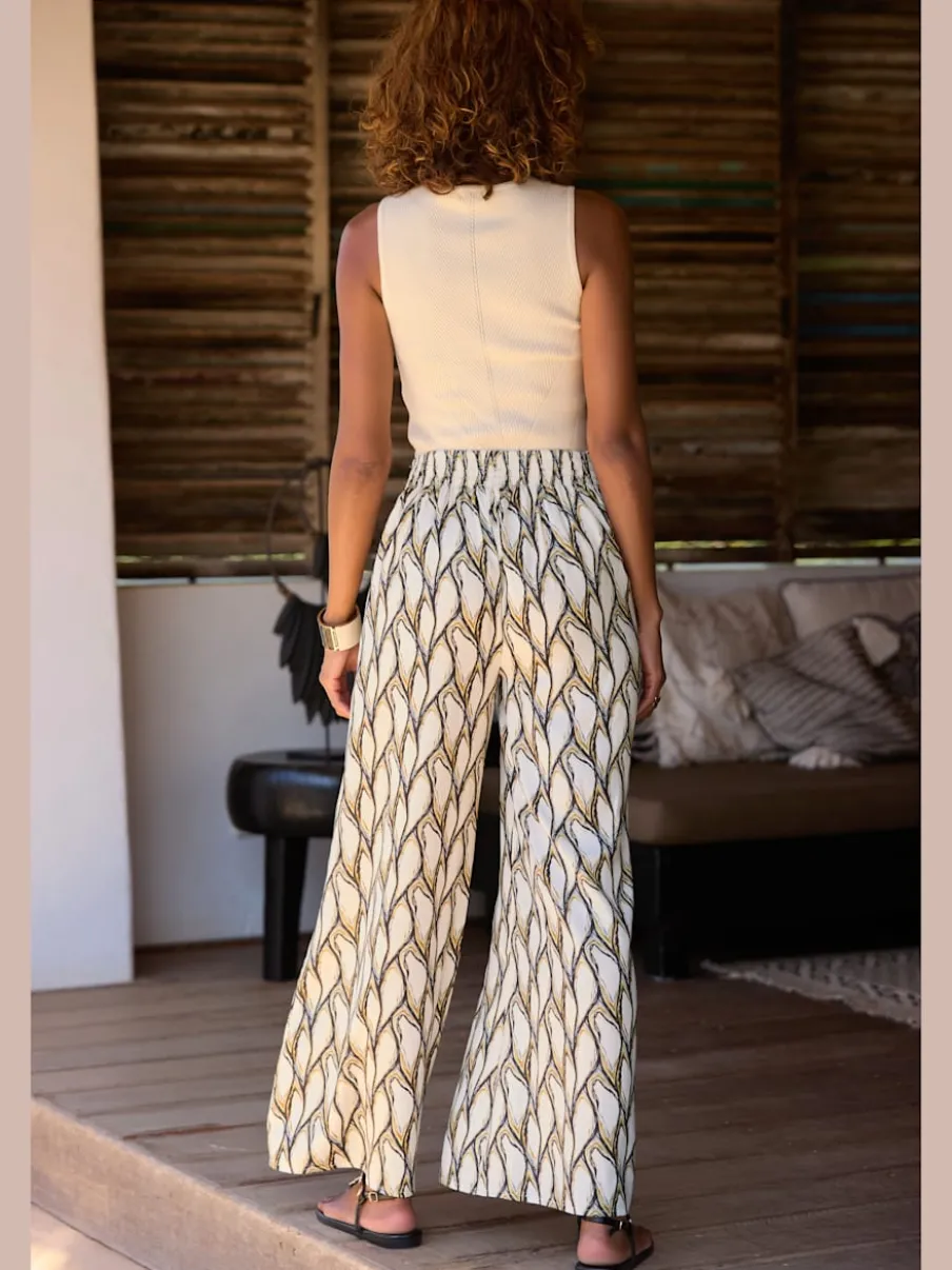 Pantalon large à motifs avec ceinture smockée et poches latérales