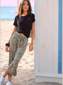 Pantalon léger à la coupe large avec imprimé floral à la longueur 7/8
