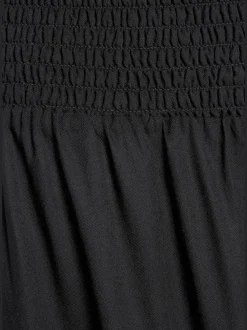 Pantalon léger à large ceinture avec fentes arrondies