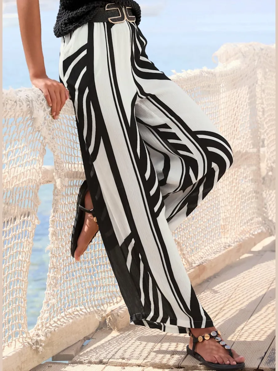 Pantalon palazzo estival avec imprimé intégral et poches latérales