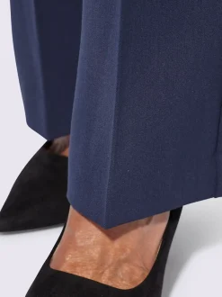 Pantalon à plis repassés avec jambes larges et ceinture gainante