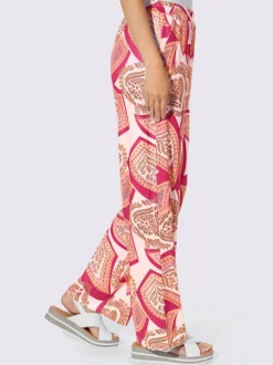 Pantalons fluides à l'imprimé extravagant avec poches