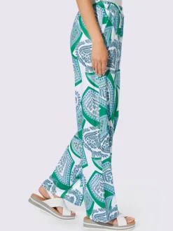Pantalons fluides à l'imprimé extravagant avec poches