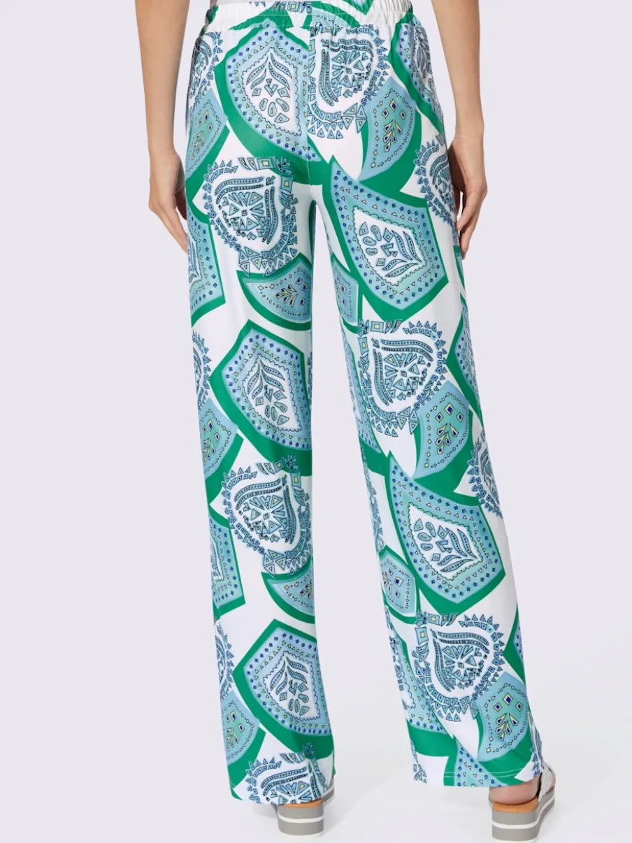 Pantalons fluides à l'imprimé extravagant avec poches