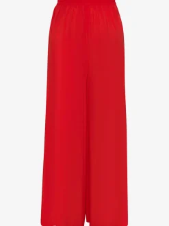 Pantalons fluides à poches latérales et taille élastiquée