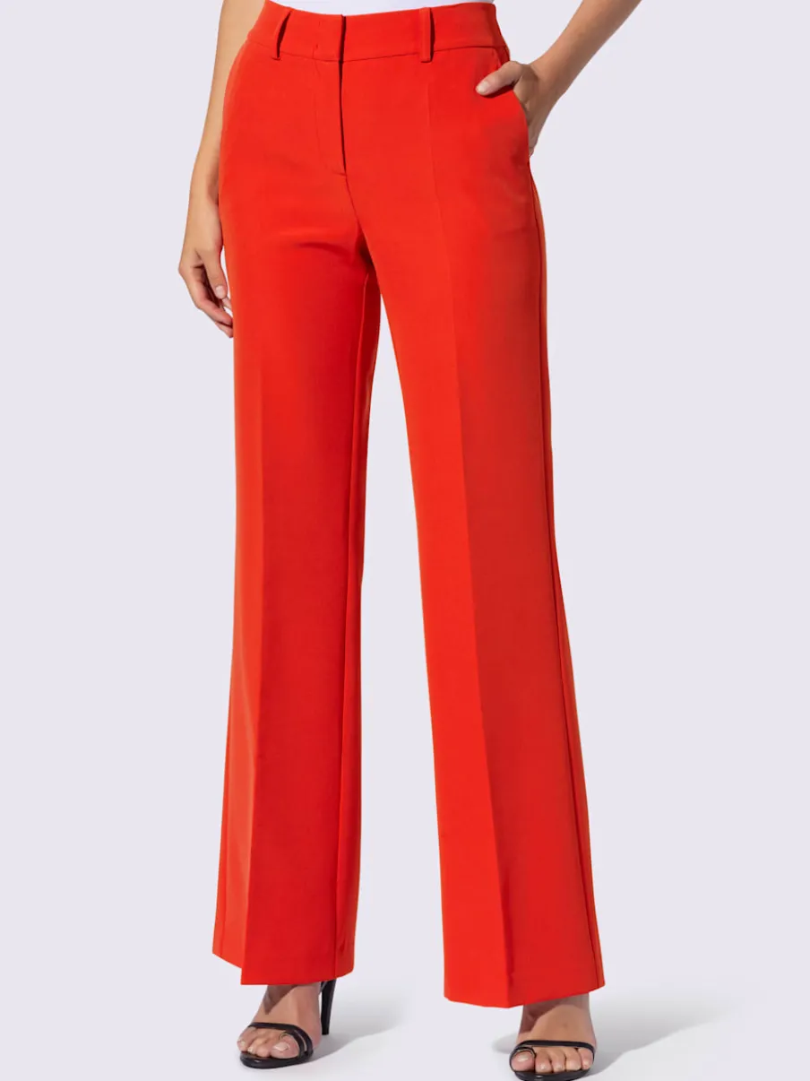 Pantalons à jambes larges avec plis et poches décoratives