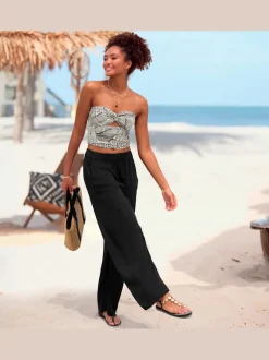 Pantalons larges en viscose avec poches latérales fendues