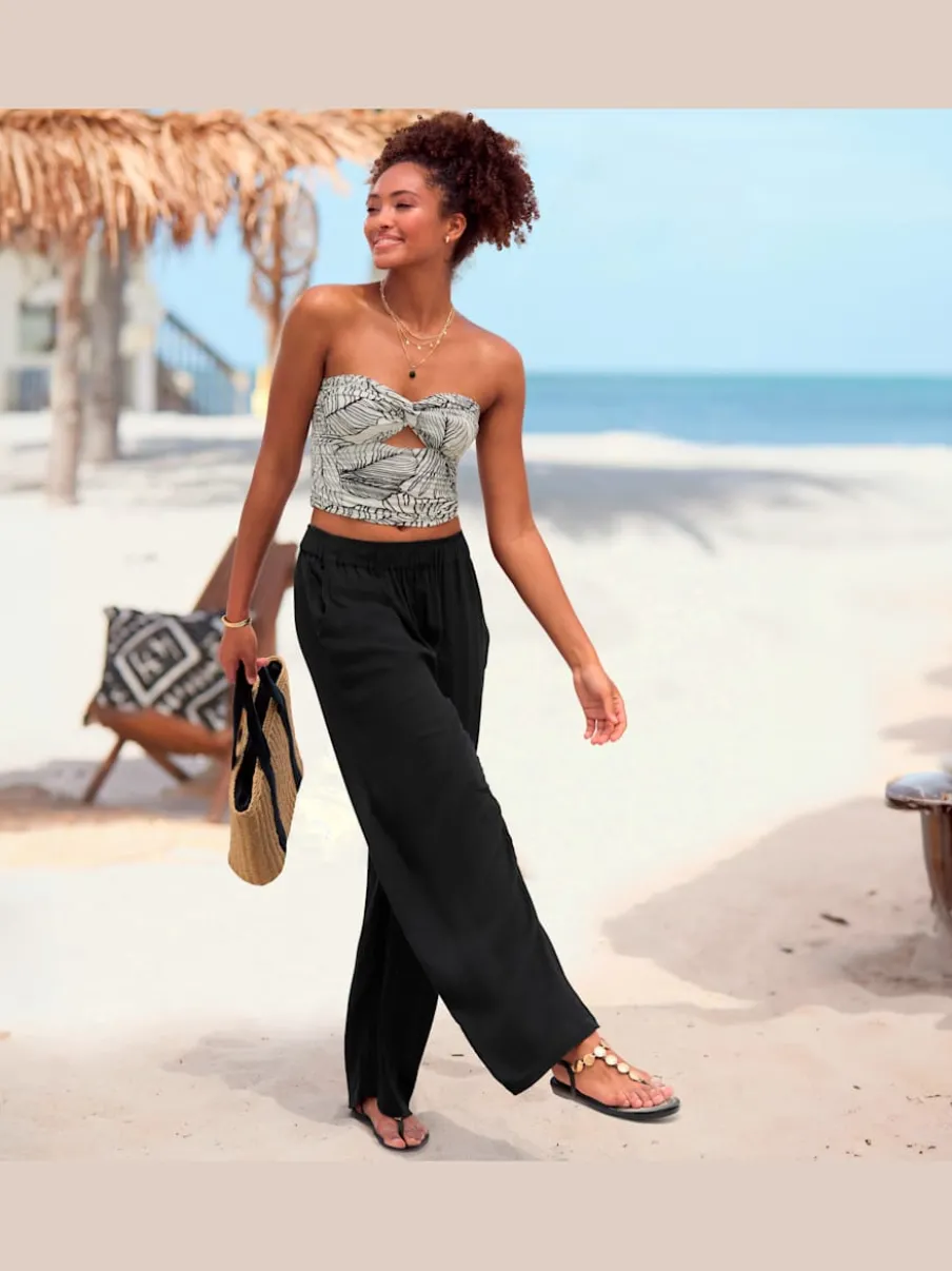 Pantalons larges en viscose avec poches latérales fendues