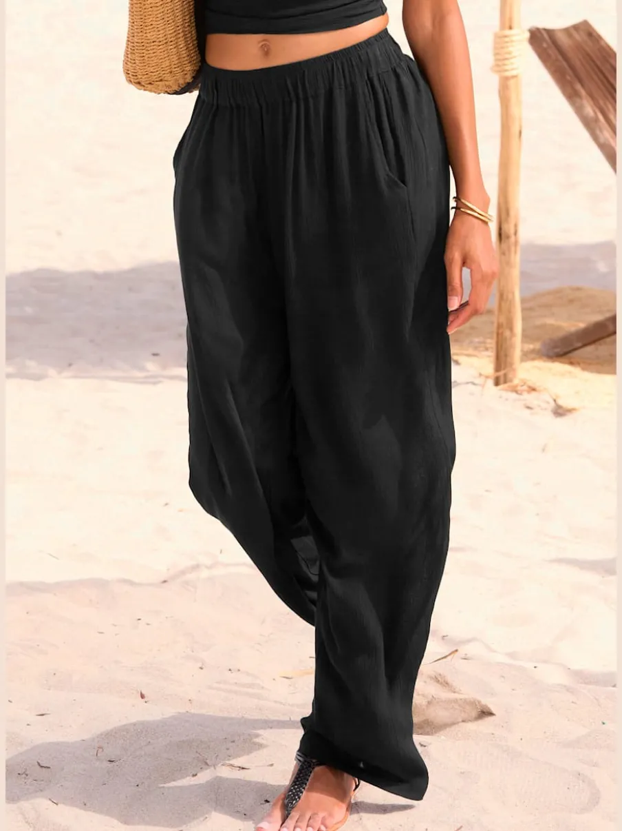 Pantalons larges en viscose avec poches latérales fendues
