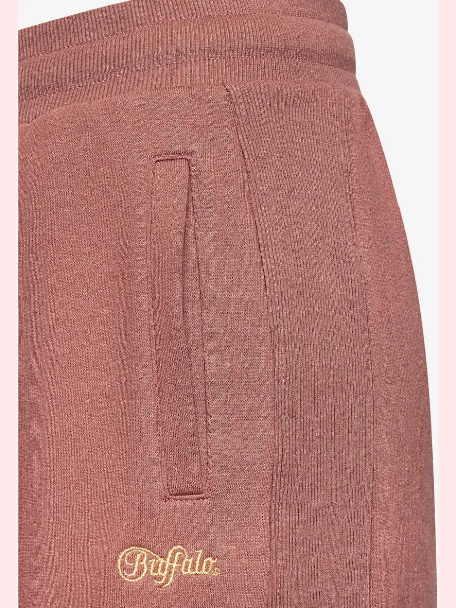 Pantalons moulants avec poches élastiques et empiècements côtelés