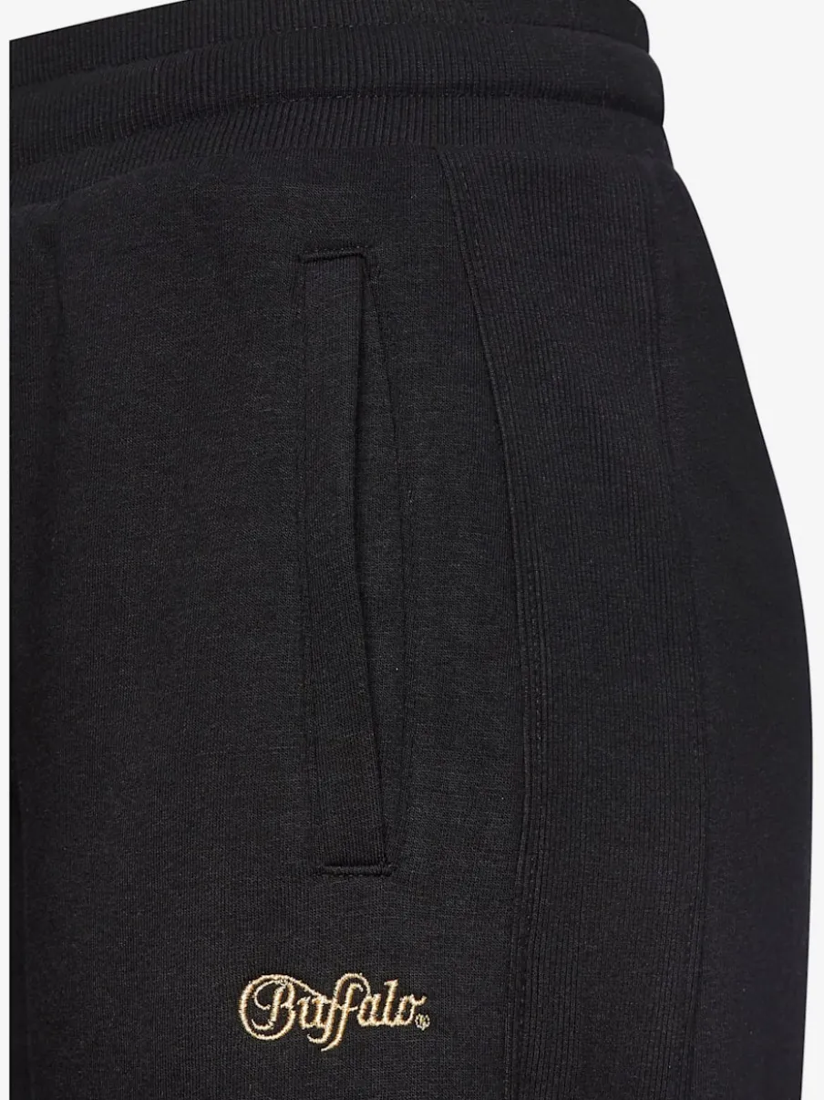 Pantalons moulants avec poches élastiques et empiècements côtelés
